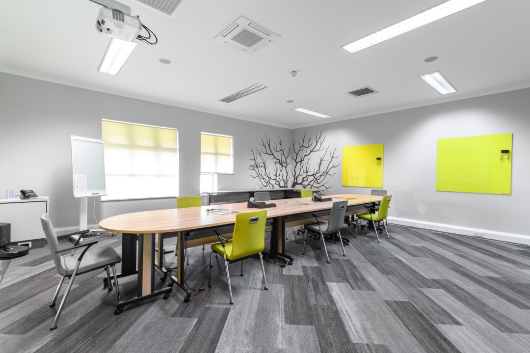 modern meeting room with yellow and grey chairs