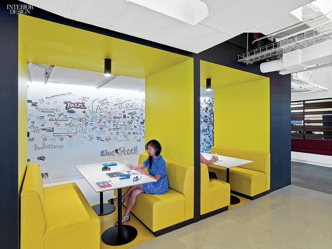 modern office yellow meeting booths with people writing