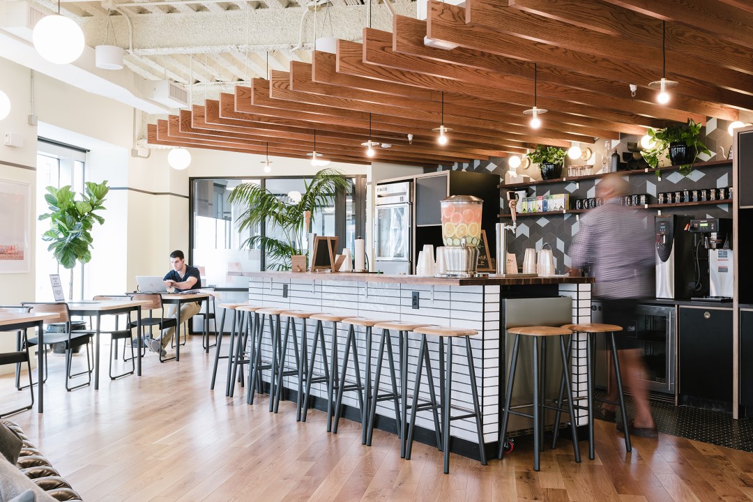 modern cafe interior with bar stools and wooden ceiling