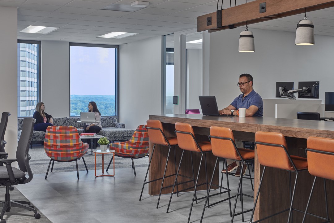 modern office space with people working and chatting