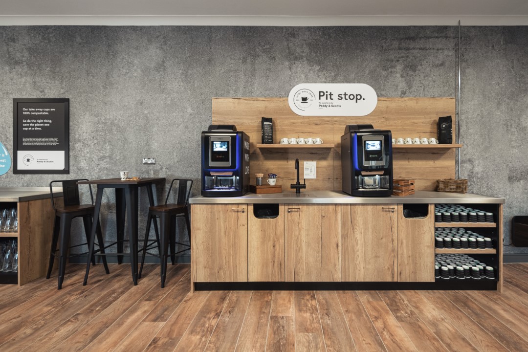 coffee station with two coffee machines and stools