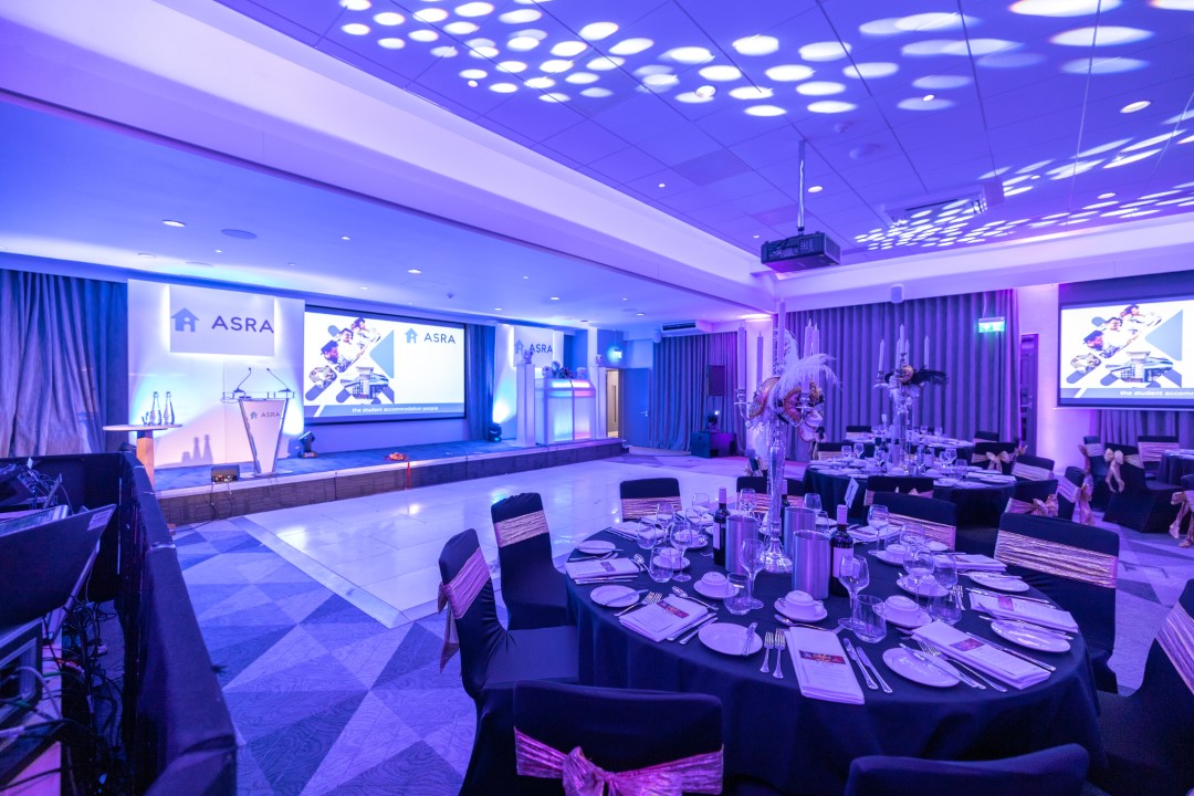 event hall set up for formal dinner and presentation