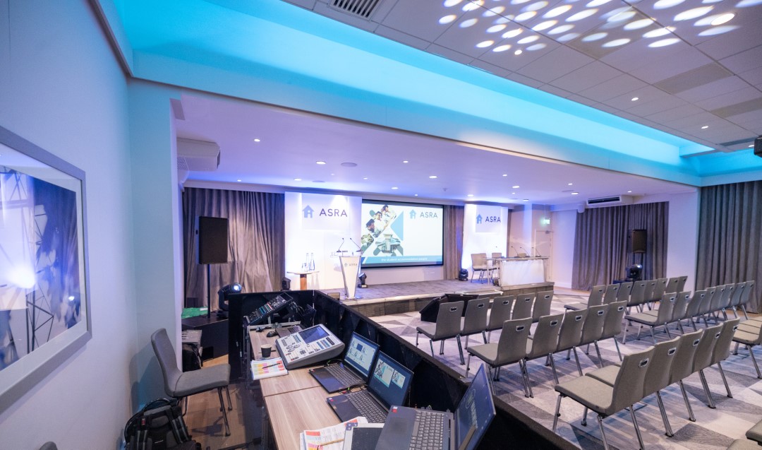 empty conference room with chairs and laptop computers