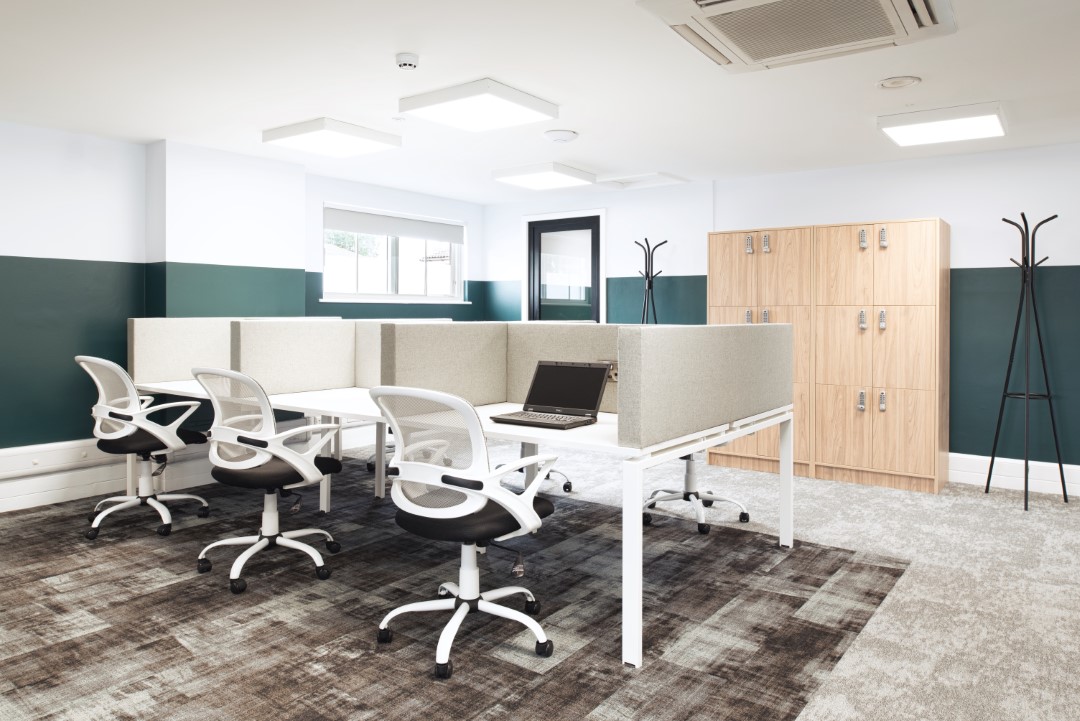 modern empty office space with desks and chairs
