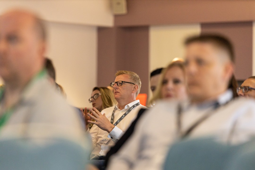 people sitting listening at a conference or seminar