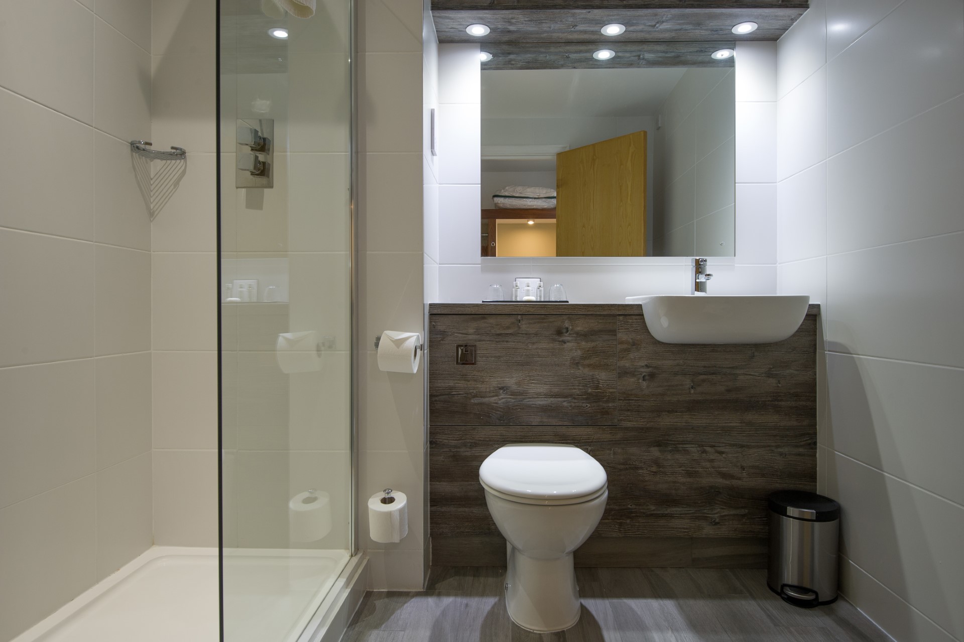 small modern bathroom with toilet shower and sink