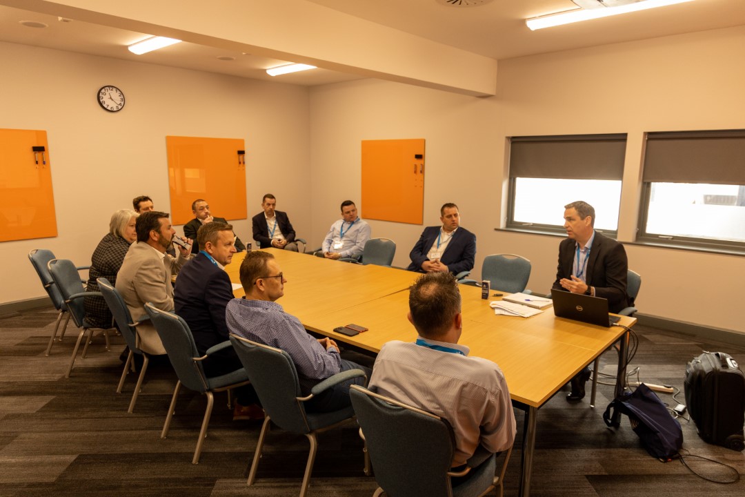 group of people having a meeting in a conference room
