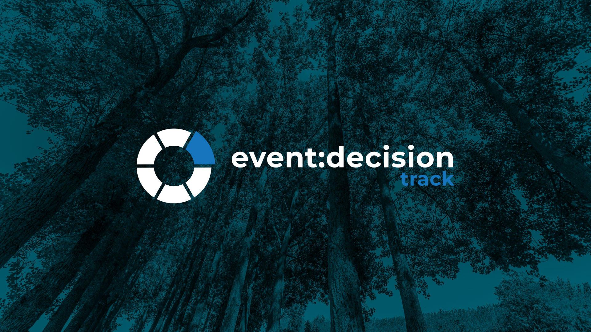 forest trees seen from below with circular logo and text