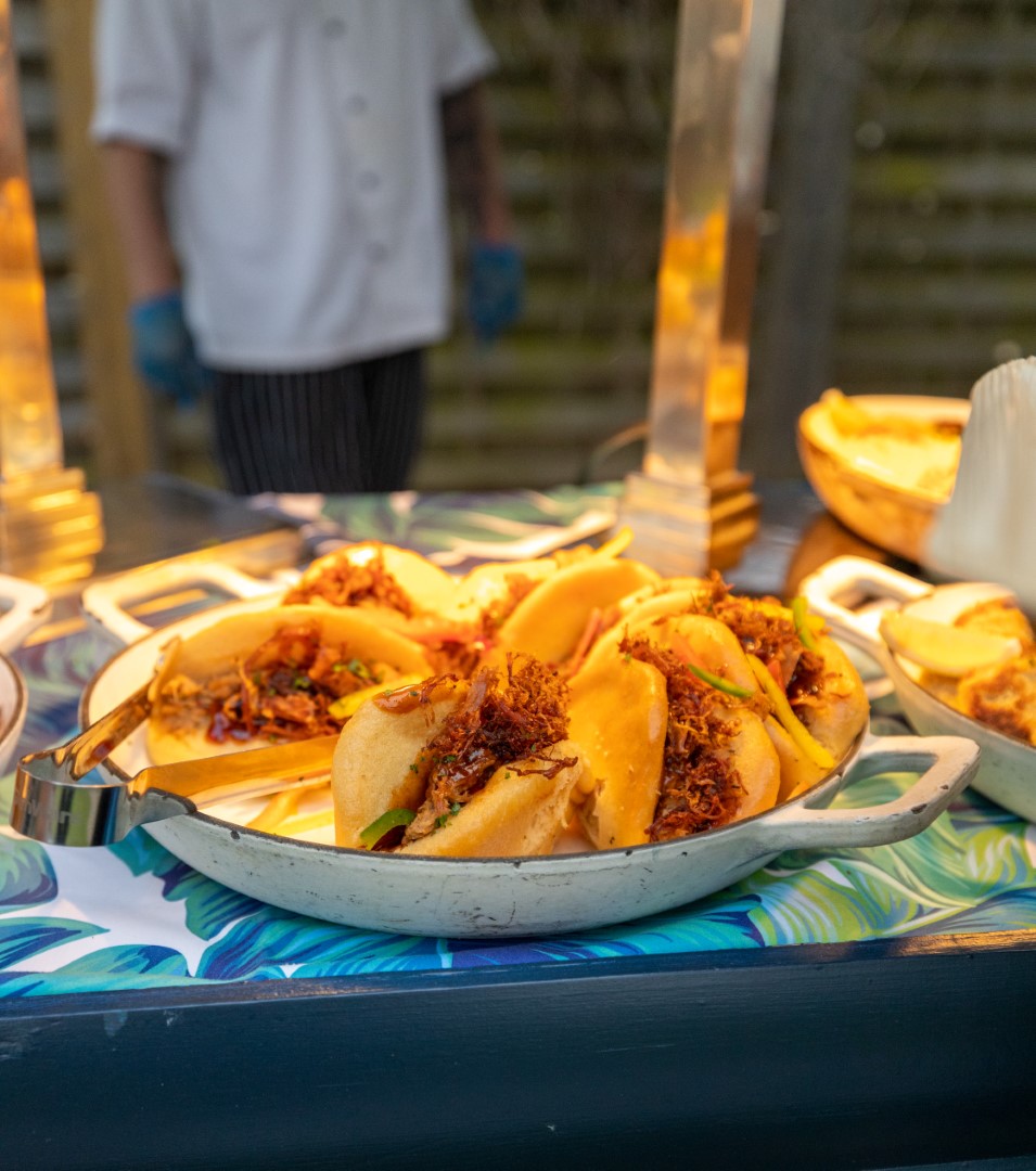 tray of pulled pork sandwiches at buffet table