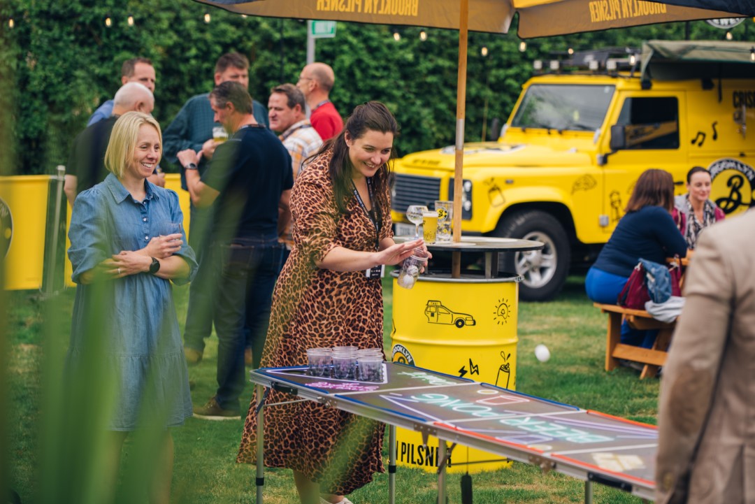 people playing beer pong in garden party