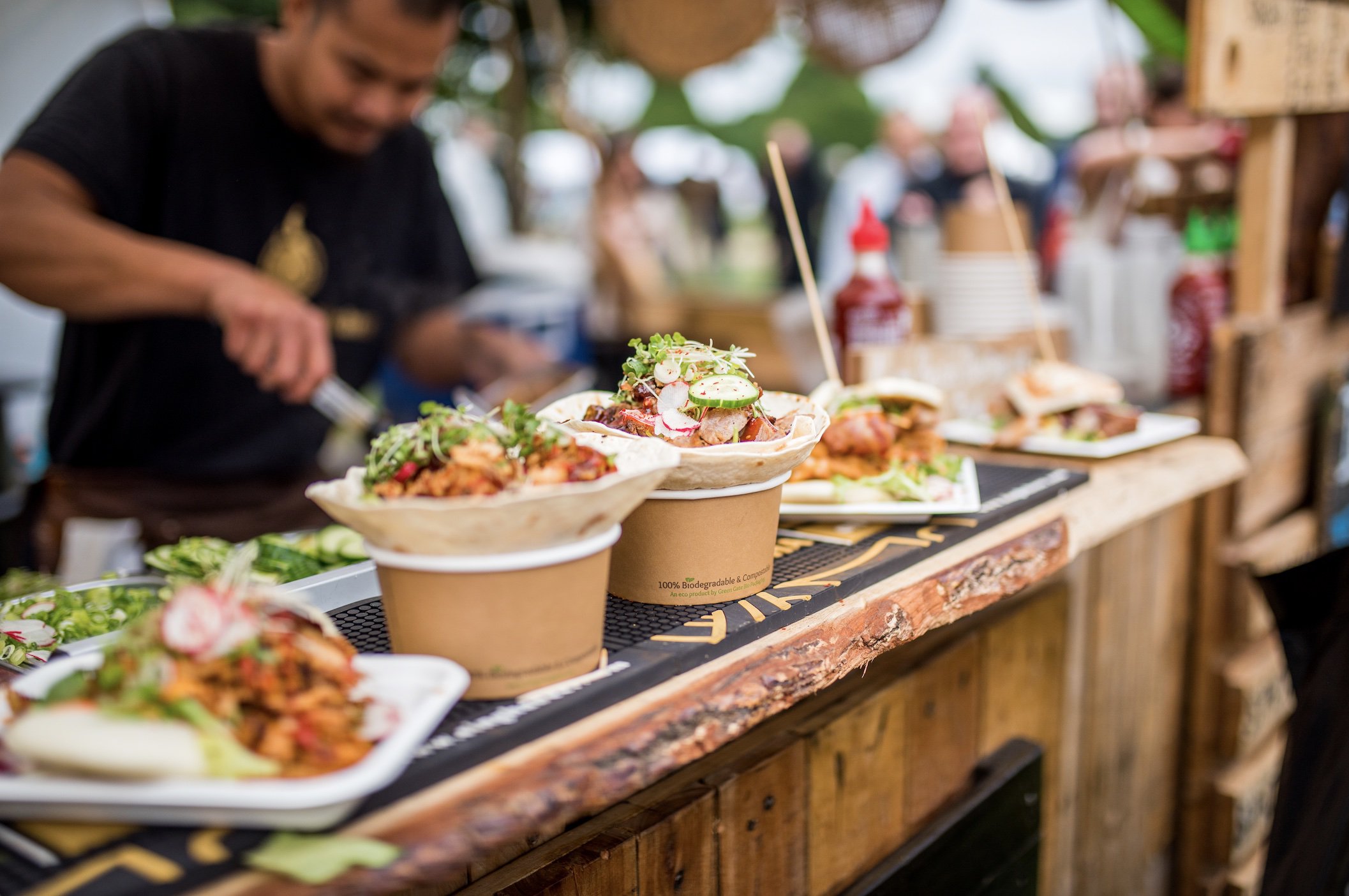 street food tacos served on wooden stall counter