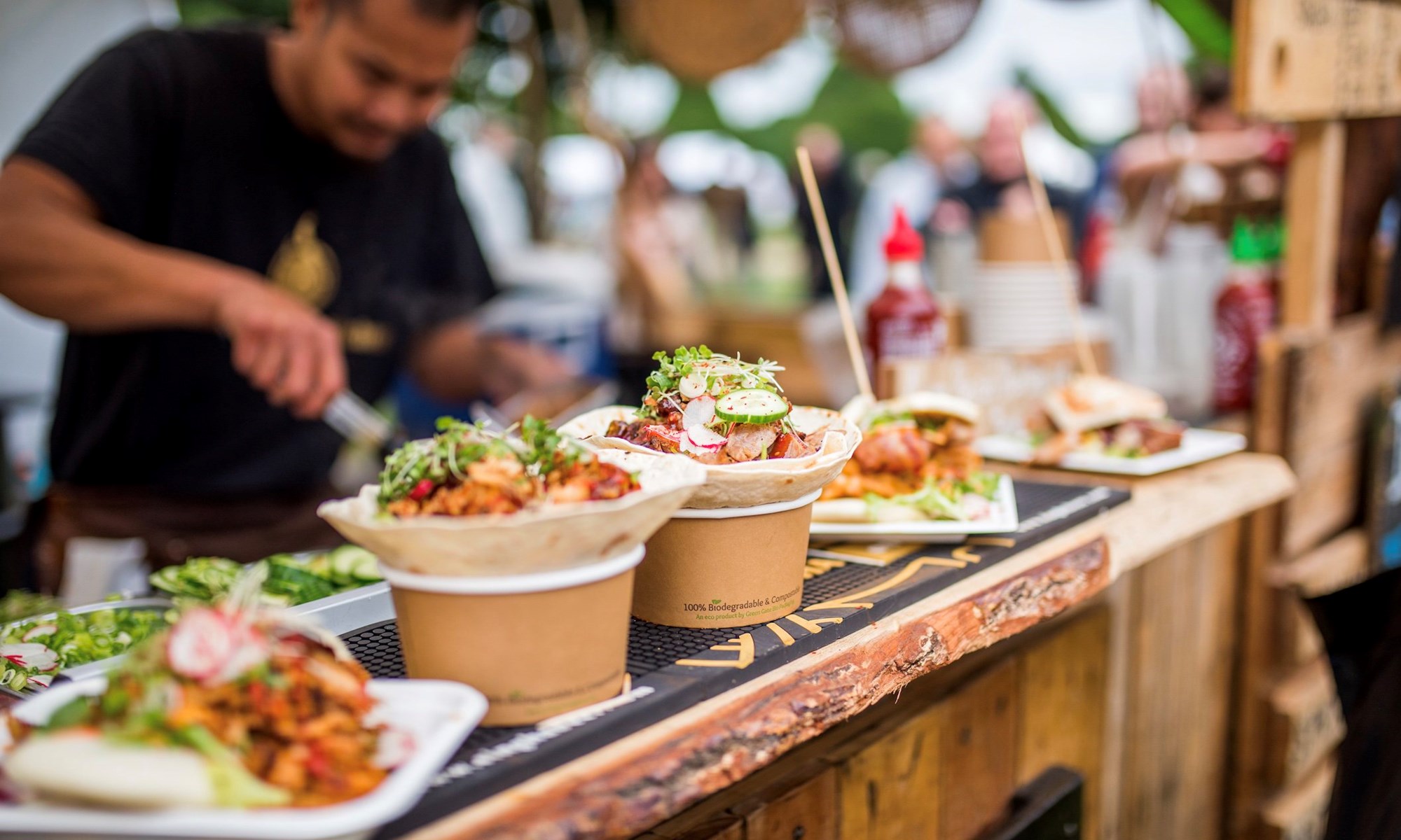 street food tacos served on wooden stall counter