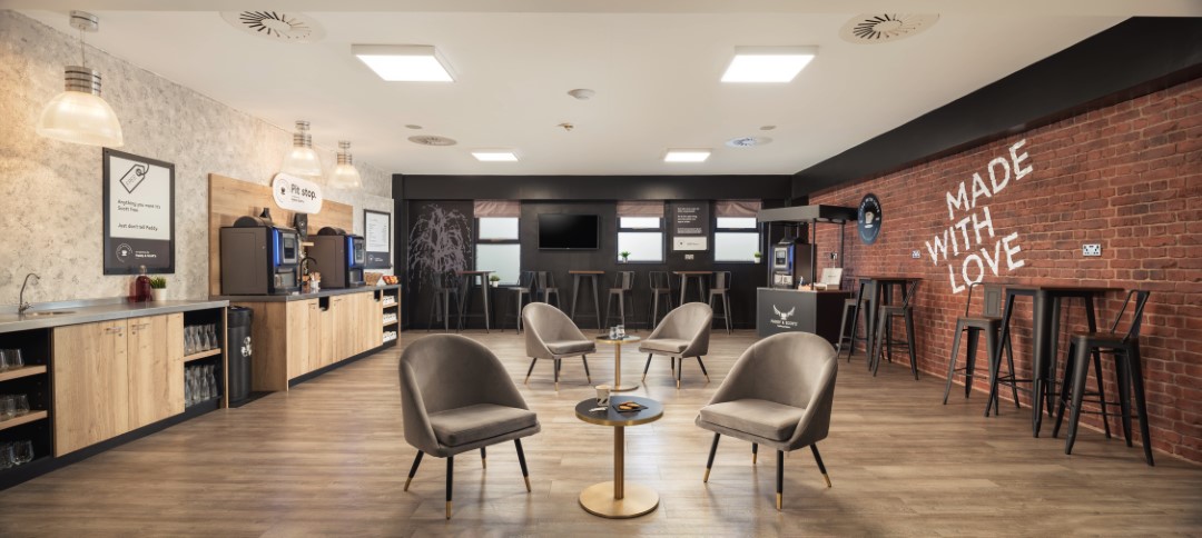 modern coffee lounge with chairs tables and machines