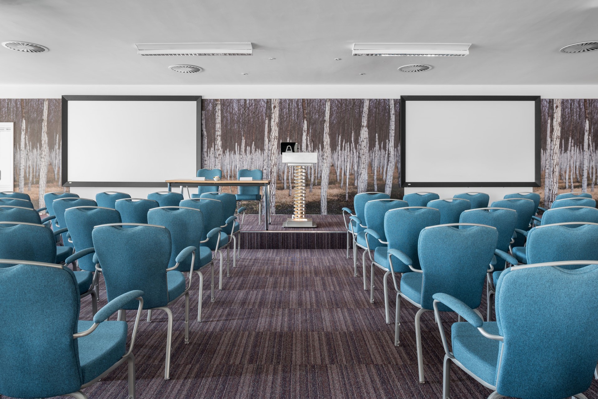empty conference room with blue chairs and two projectors