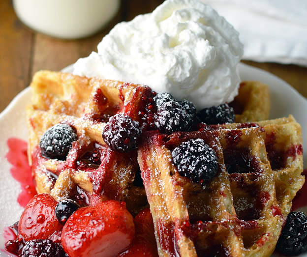 waffles with mixed berries and whipped cream