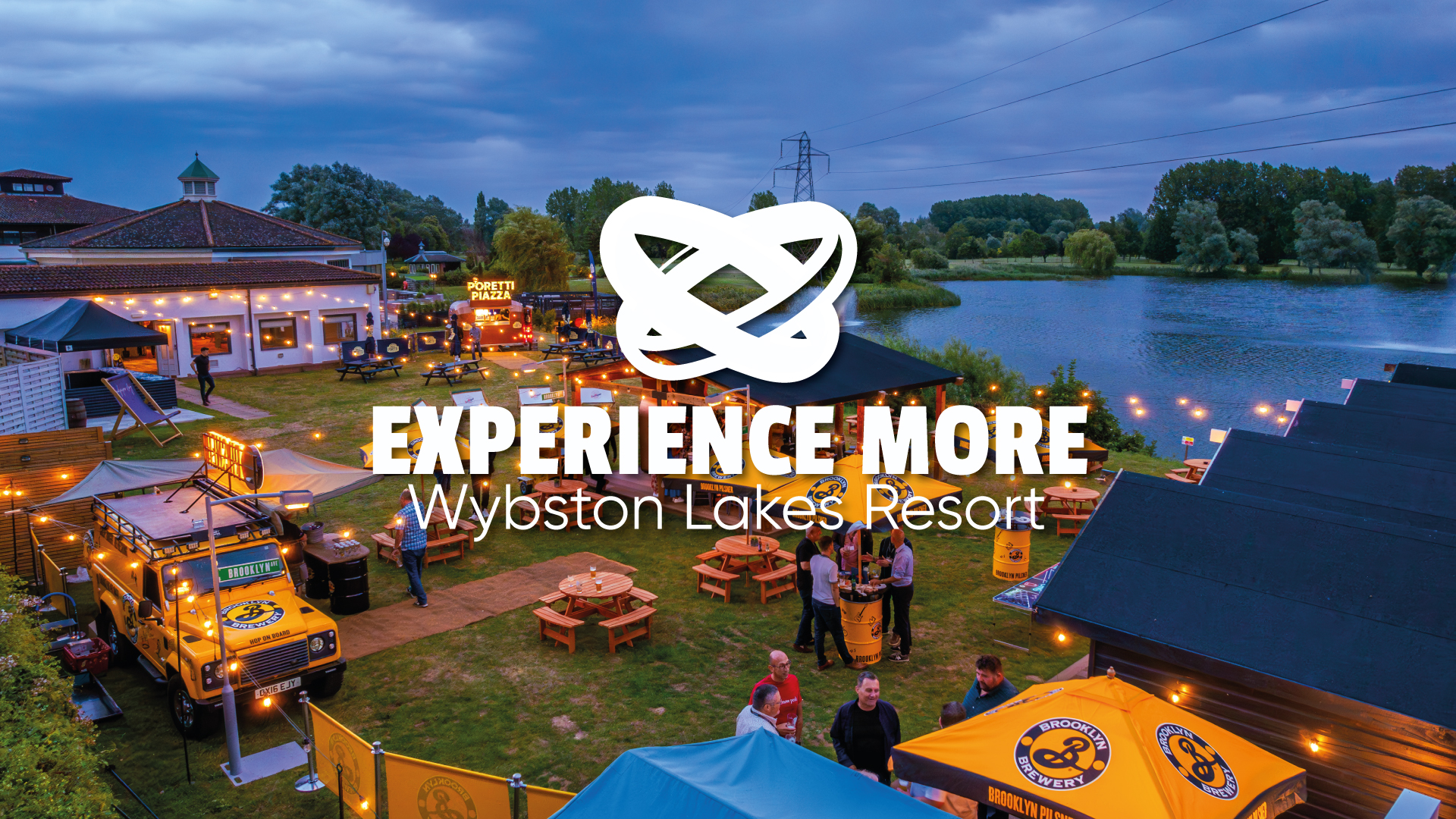 evening lakeside outdoor bar with people and lights