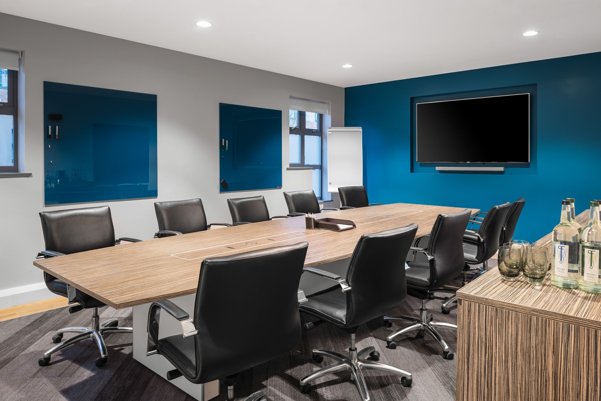 modern conference room with black chairs and wooden table