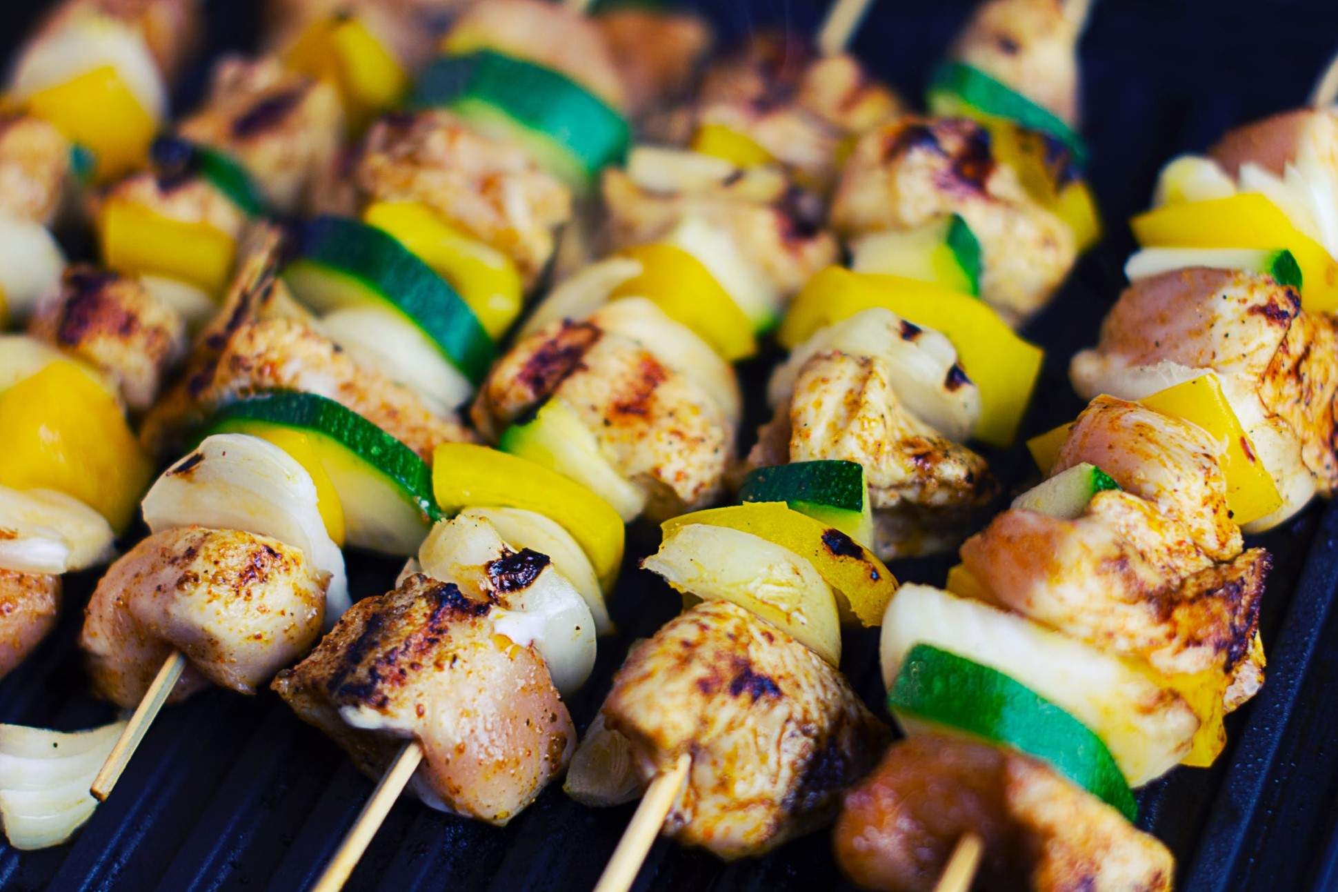 grilled chicken and vegetable skewers on hot grill