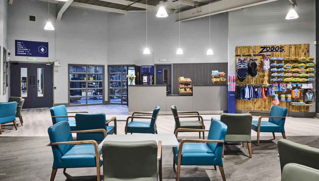 indoor seating area near reception with swimming accessories display