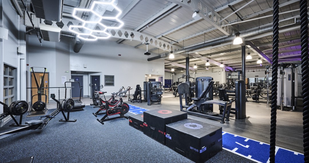modern gym interior with exercise machines and platforms