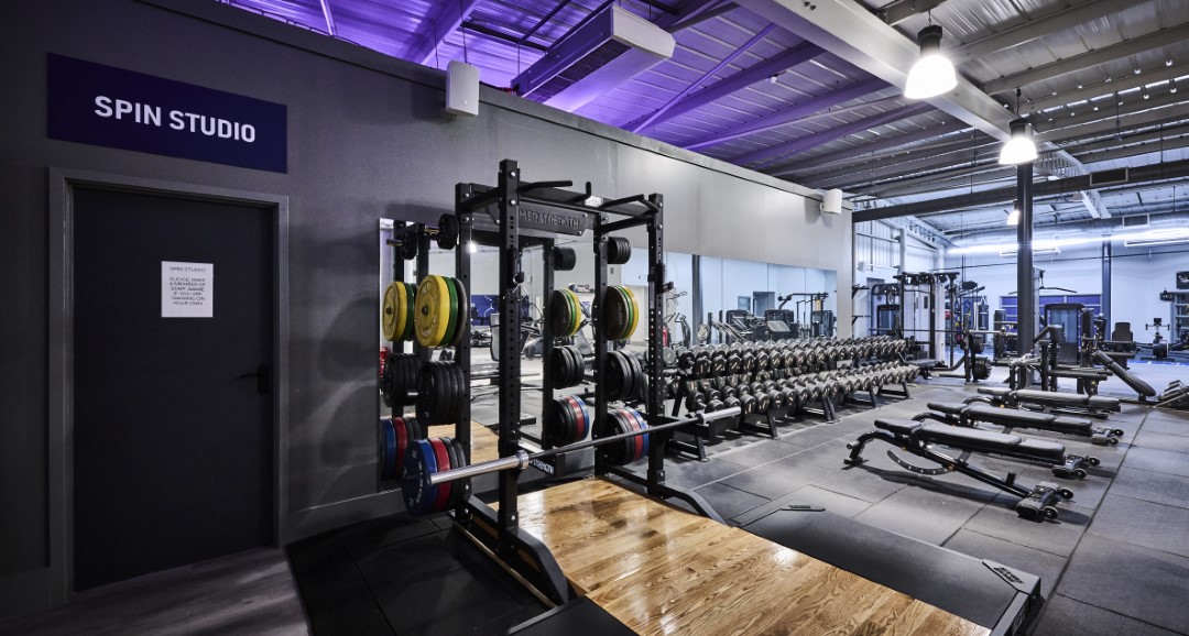 empty modern gym with weights and benches (1)