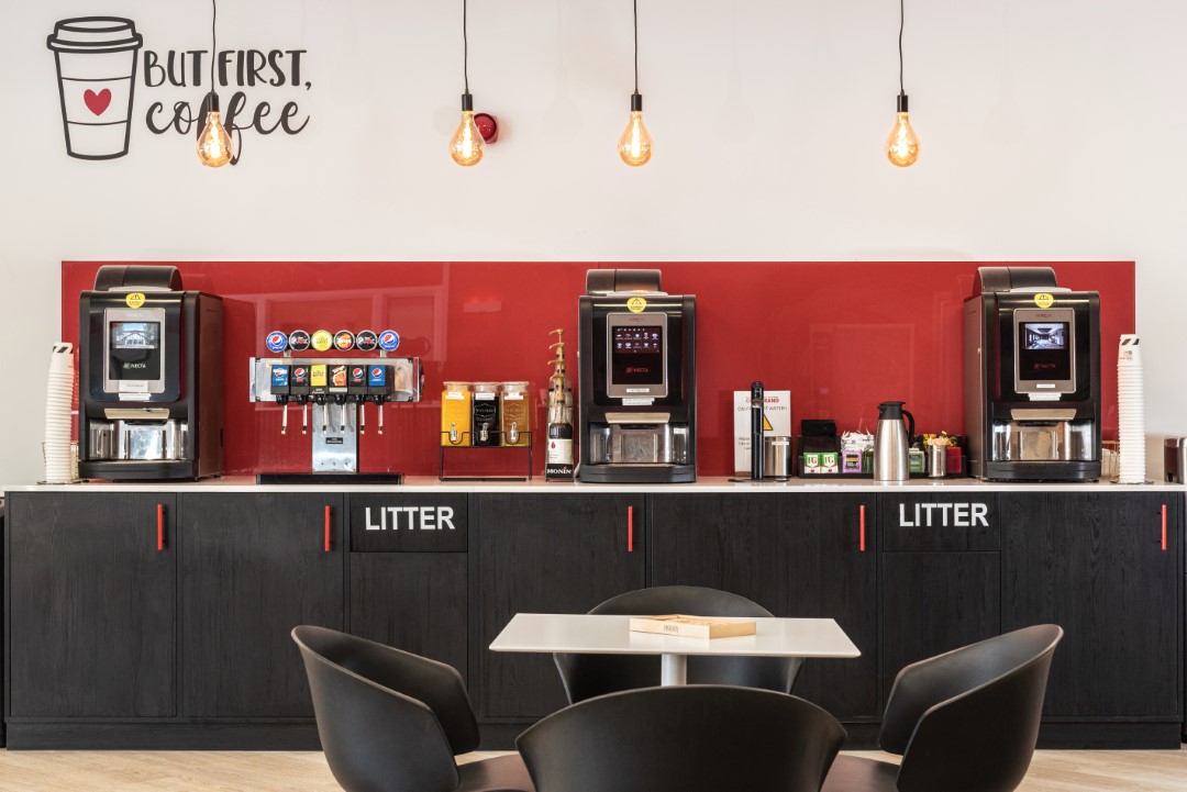 coffee machines and drink dispensers in self service area