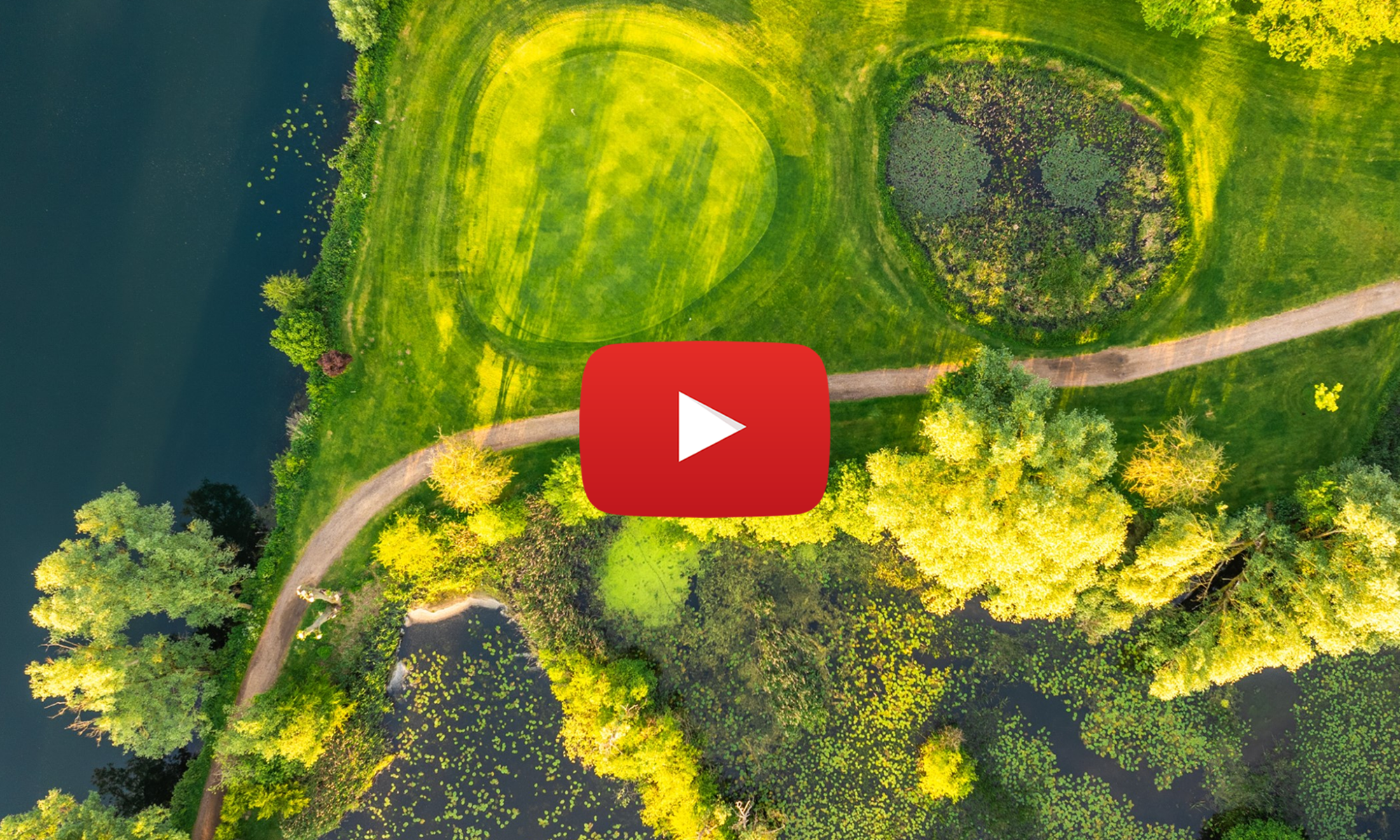 aerial view of lake grassy park and footpath