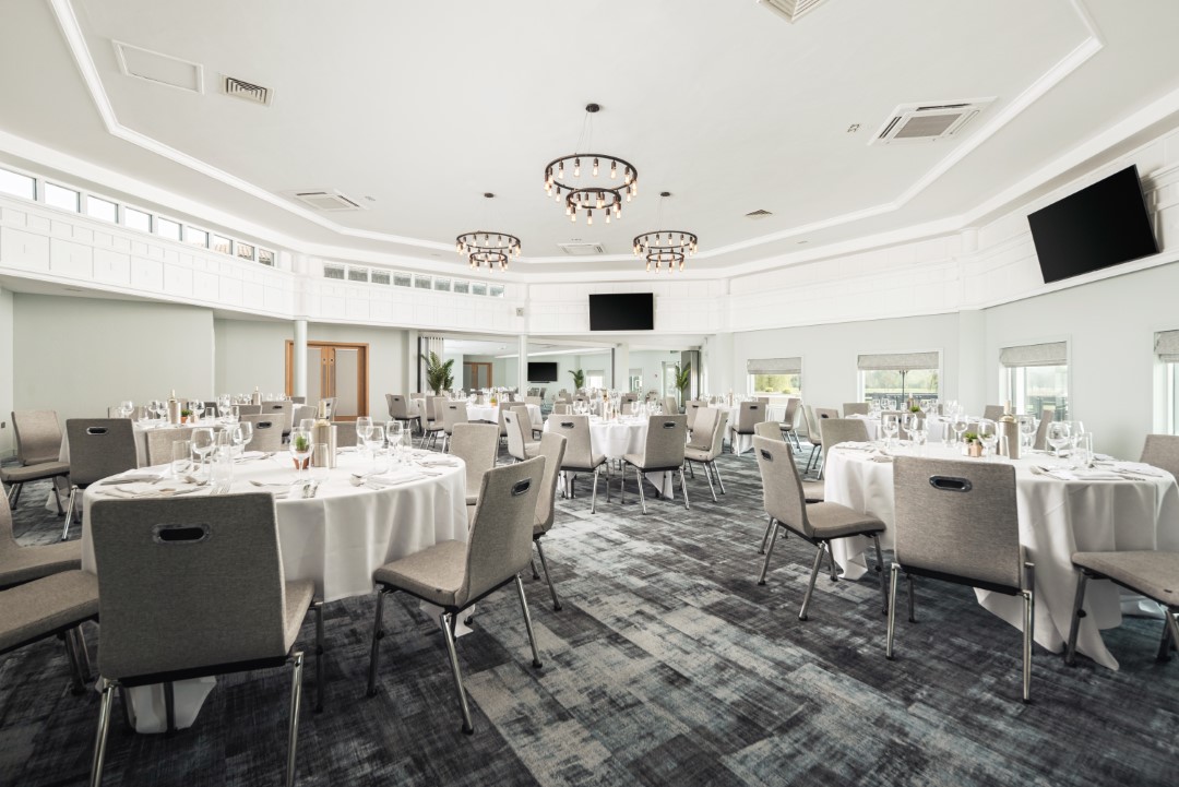 empty modern dining hall with round tables and chairs