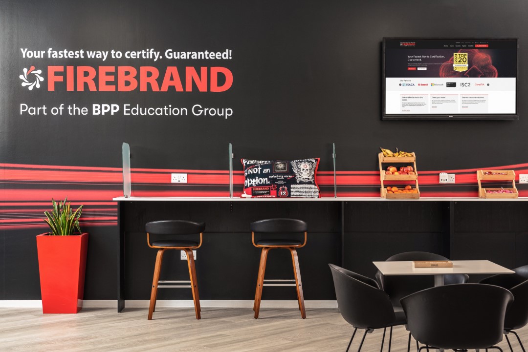 modern office space with stools screen and fruit stand