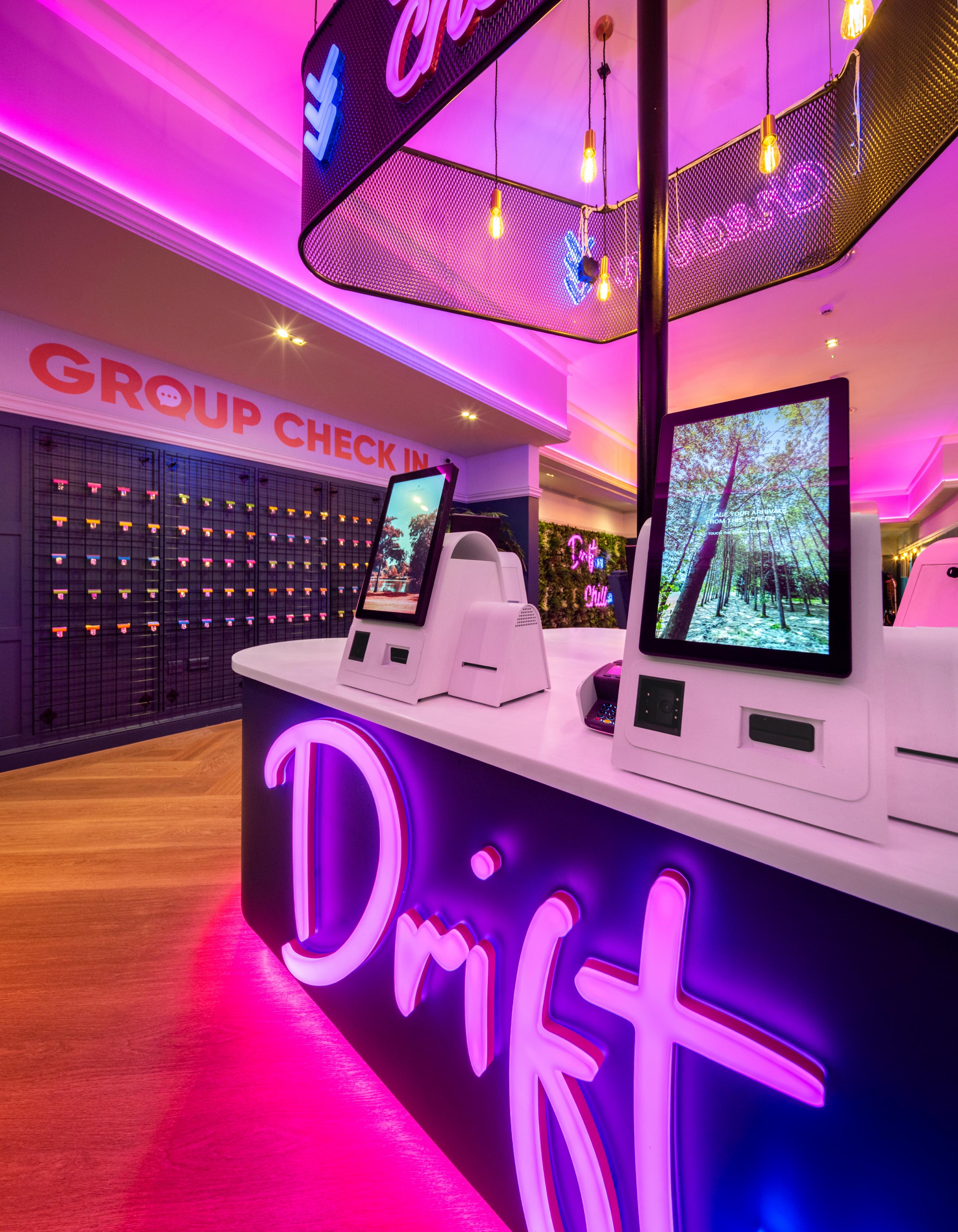 modern check in counter with self service kiosks and neon