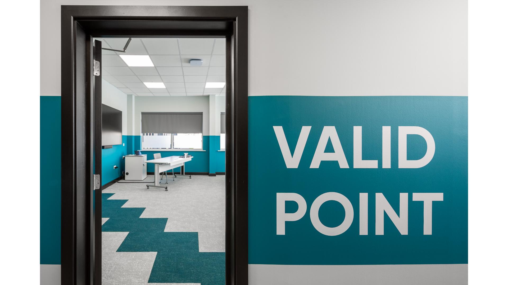 empty office room with teal and grey carpet pattern
