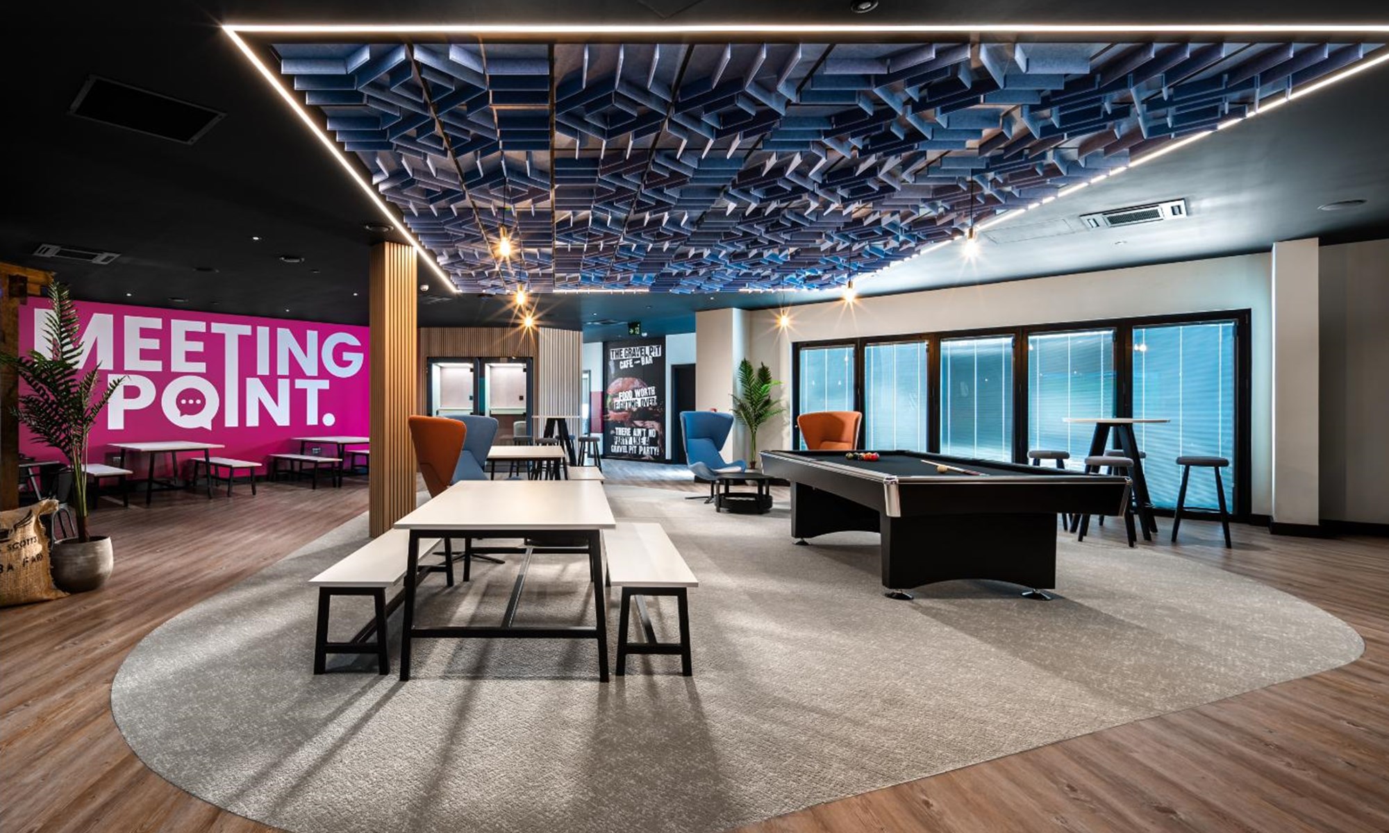 modern indoor games room with pool table and seating