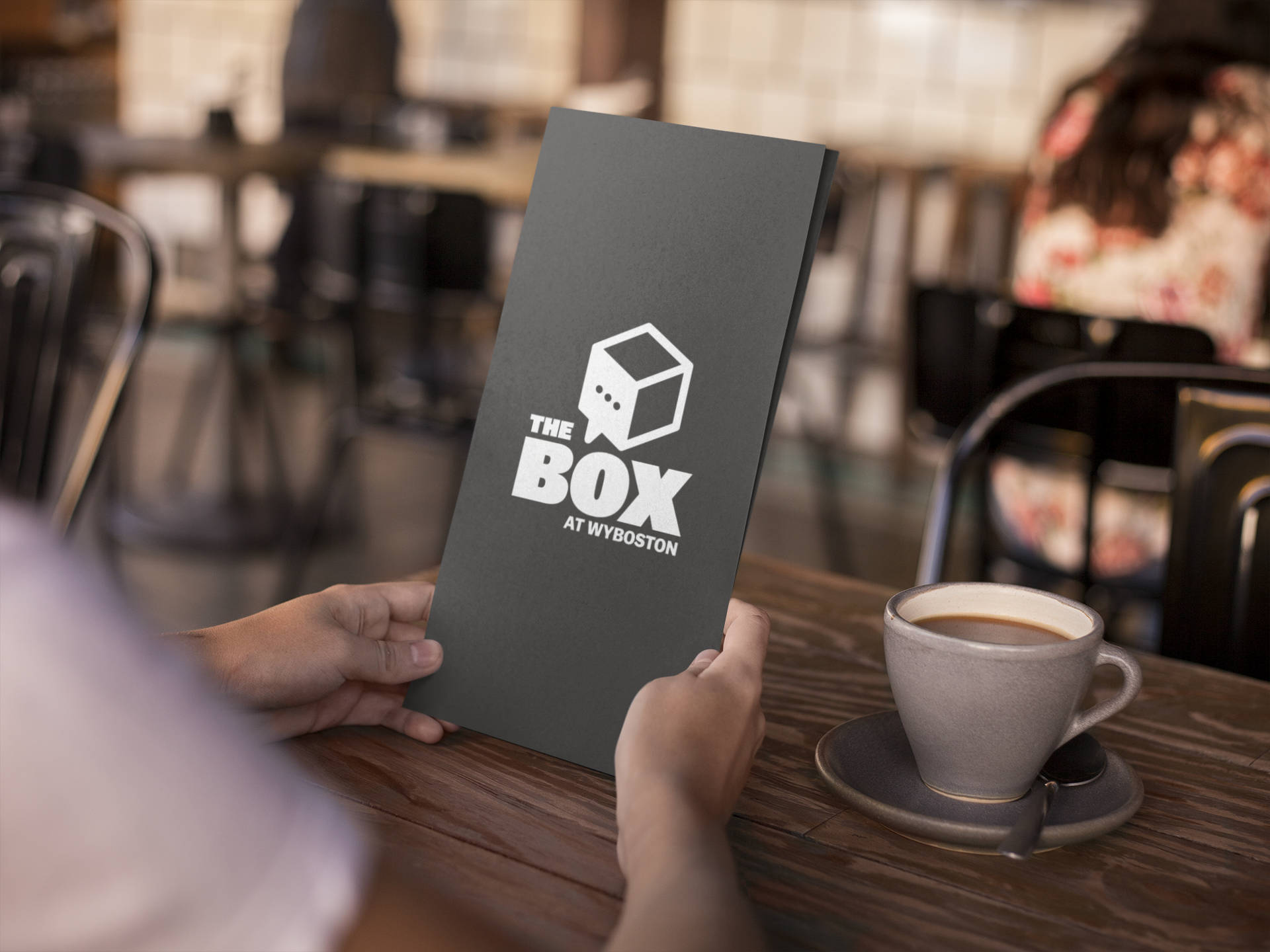 Box Over Shoulder Template Of A Young Girl Holding A Menu Booklet While In A Cafe A14768
